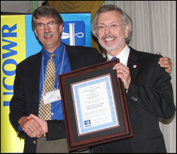 Photo of Bob Pietrowsky, Director of IWR (right), receiving award from UCOWR Executive Director Christopher Lant.